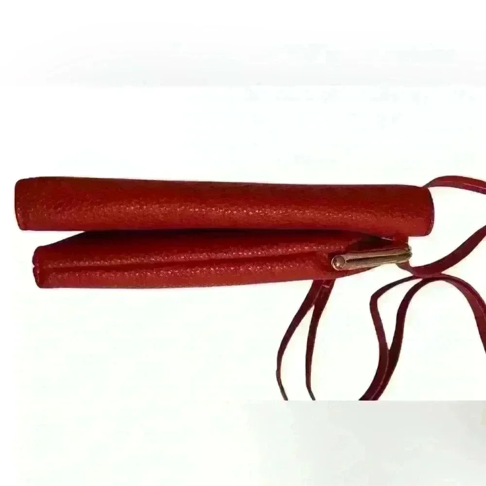 A Forever Young red woman’s,Crossbody bag / wallet with attached iPhone carrier.